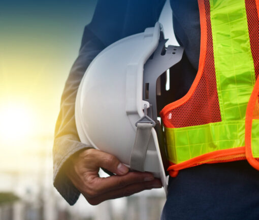 image of worker holding a hard hat