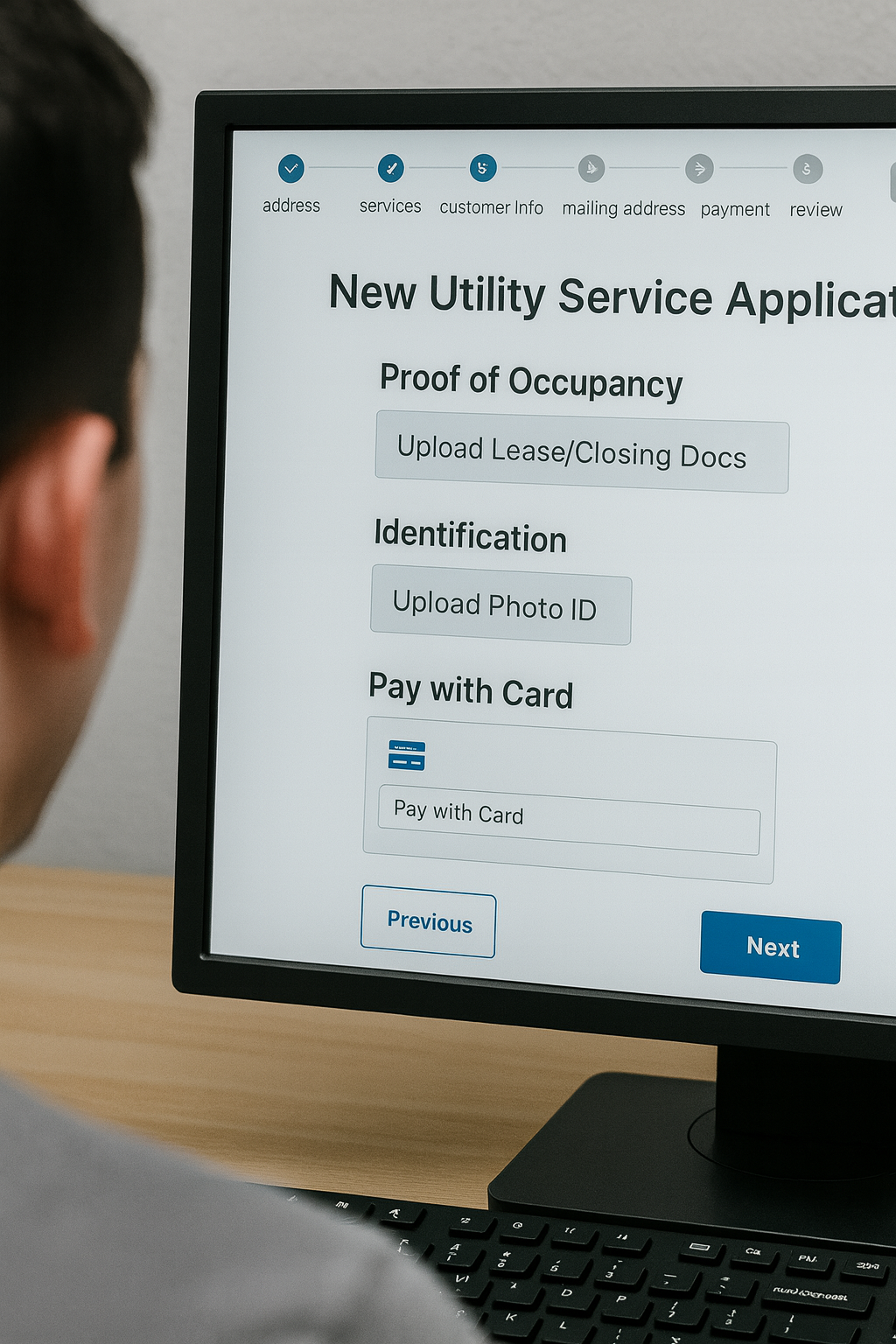 A man viewing a website on a computer screen asking for proof of ID and deposit to set up a new utility service application